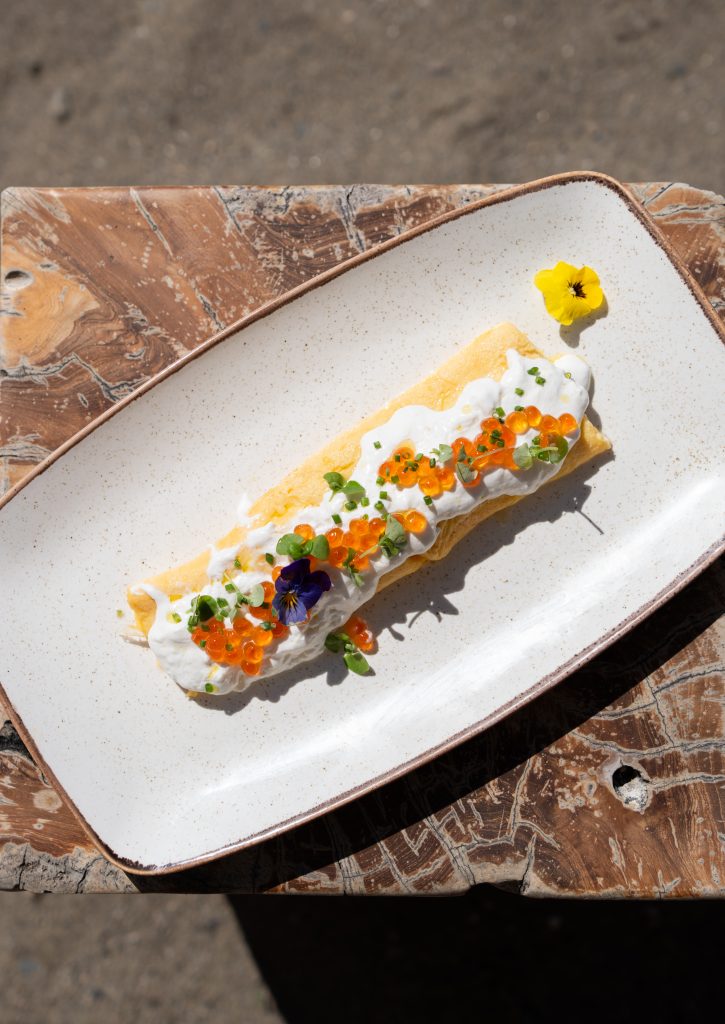 Plain omelette topped with stracciatella and red caviar.