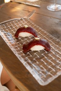 Hand-formed rice topped with tuna slice.